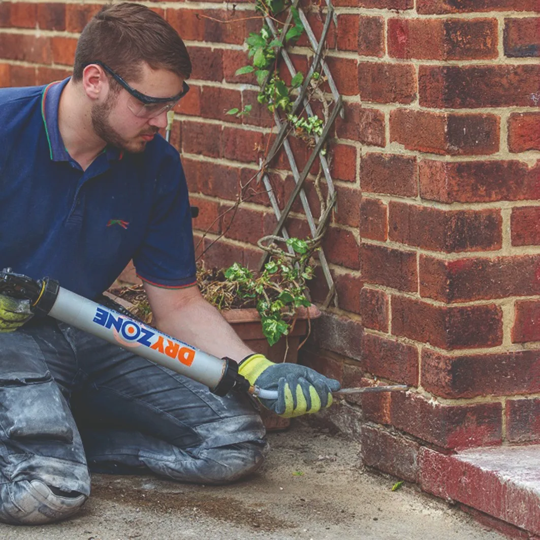 Applying a damp proof cream