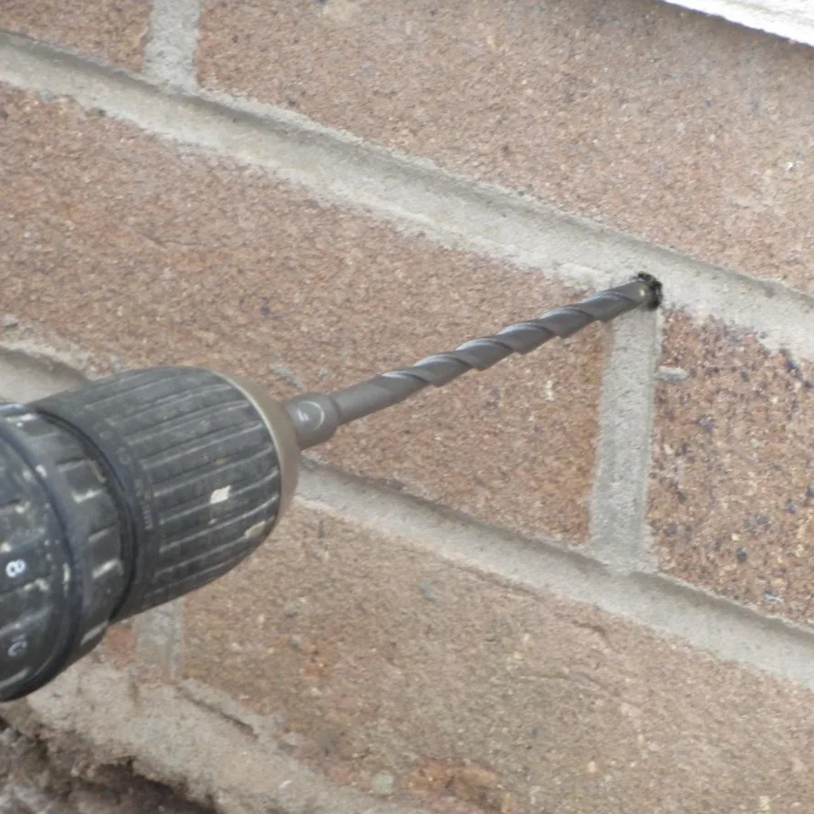 Drilling for a damp proof course